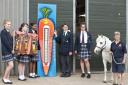 Chigwell School Art+ students with Chigwell Riding Trust manager Deborah Hall, right