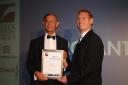 Volunteer Len Stuart (L) getting his certificate from the Essex Tourism Awards
