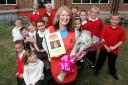 Theresa Letchford with some of the grateful pupils at Upshire Primary School (EL16563-2)