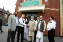 PC Steven MacDonald hands over the funding to members of the Waltham Forest Islamic Association at Lea Bridge Road Mosque