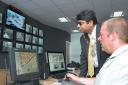 WATCHING US, WATCHING YOU: operator Stephen Darby with Redbridge Mayor Cllr Ashok Kumar 	(c)