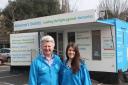 The roadshow team Fionna Colgan and John Hall standing outside the mobile information unit