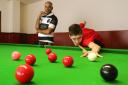 Snooker coach Josh Raja with student Peter Devlin at Pocket Aces in Leytonstone.