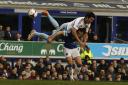 Everton's Leighton Baines (bottom) is challenged by West Ham United's James Tomkins. Picture: Action Images