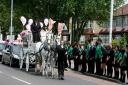 Schoolchidren line the streets during seven-year-old Mackenna Channing's funeral procession