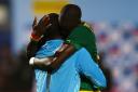 Senegal's goalkeeper Bouna Coundoul celebrates with teammate Cheikhou Kouyate Picture: Action Images