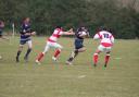 Bancroft’s Luke Robinson escapes the attention of two tackles from Upper Clapton players on Saturday     pic Maxine Ferris