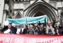 Former post office workers celebrate outside the Royal Courts of Justice, London, after having their convictions overturned by the Court of Appeal (Image: PA)