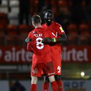 Leyton Orient's Craig Clay and Ousseynou Cisse celebrate at the end of the Sky Bet League Two match at the Breyer Group Stadium, London.
