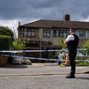 A police officer in Hainault after a 14-year-old was stabbed