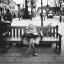 Woman on a bench on Wanstead High Street