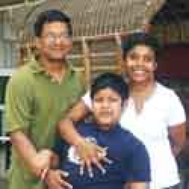  Ivan Corea with wife Charika and autistic son Charin on a visit to Sri Lanka in 2003                                            (c)