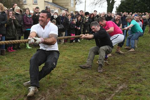 Teams from the Nag's Head and White Hart pubs in Moreton take part in there annual Boxing Day tug of war. (26/12/2012) EL33943-5