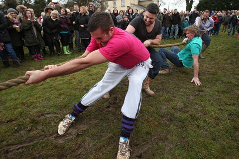 Teams from the Nag's Head and White Hart pubs in Moreton take part in there annual Boxing Day tug of war. (26/12/2012) EL33943-6