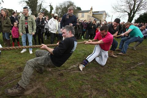Teams from the Nag's Head and White Hart pubs in Moreton take part in there annual Boxing Day tug of war. (26/12/2012) EL33943-7