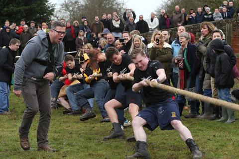 Teams from the Nag's Head and White Hart pubs in Moreton take part in there annual Boxing Day tug of war. (26/12/2012) EL33943-8