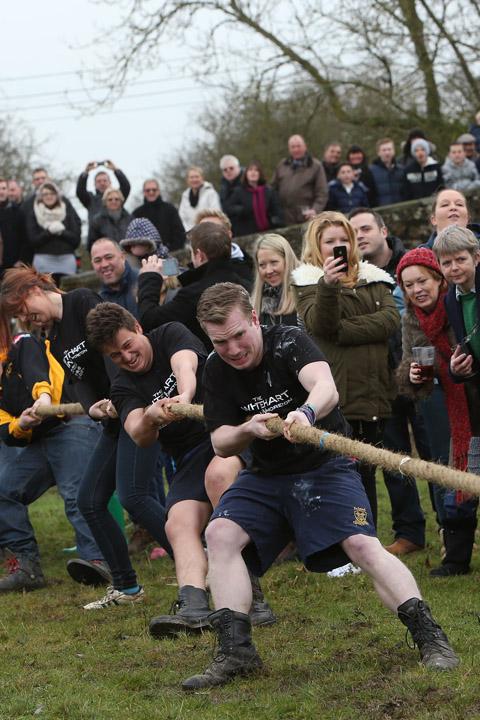 Teams from the Nag's Head and White Hart pubs in Moreton take part in there annual Boxing Day tug of war. (26/12/2012) EL33943-9