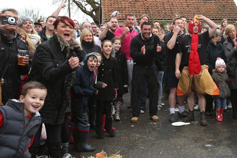 Teams from the Nag's Head and White Hart pubs in Moreton take part in there annual Boxing Day tug of war. (26/12/2012) EL33943-11
