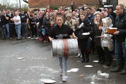 Teams from the Nag's Head and White Hart pubs in Moreton take part in there annual Boxing Day tug of war. (26/12/2012) EL33943-16