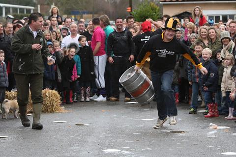 Teams from the Nag's Head and White Hart pubs in Moreton take part in there annual Boxing Day tug of war. (26/12/2012) EL33943-19