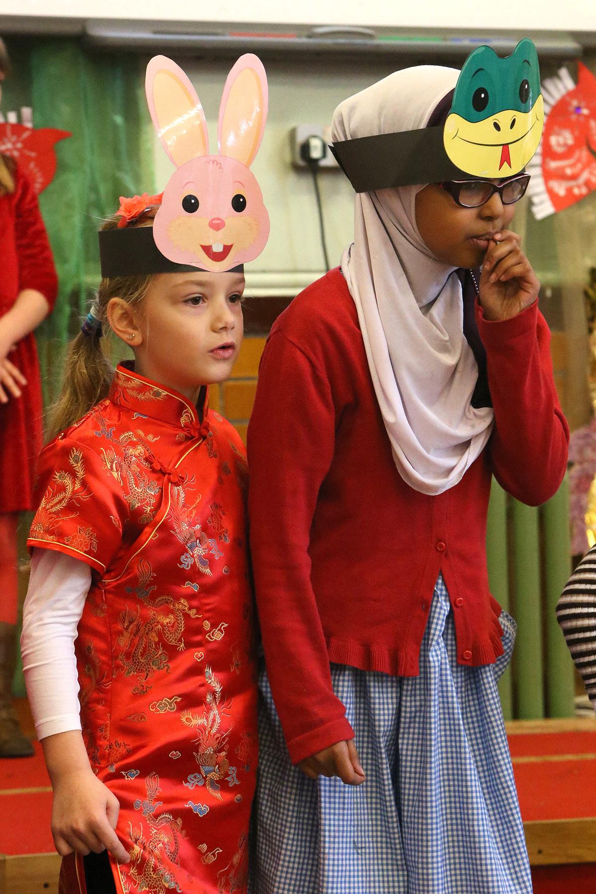 Children take part in special Chinese New Year assembly for parents at Mission Grove Primary School.  Buxton Road, Walthamstow. (31/1/2013) EL74814_3