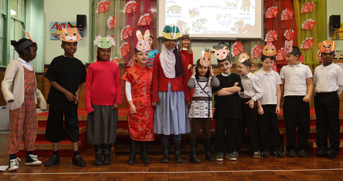 Children take part in special Chinese New Year assembly for parents at Mission Grove Primary School.  Buxton Road, Walthamstow. (31/1/2013) EL74814_6