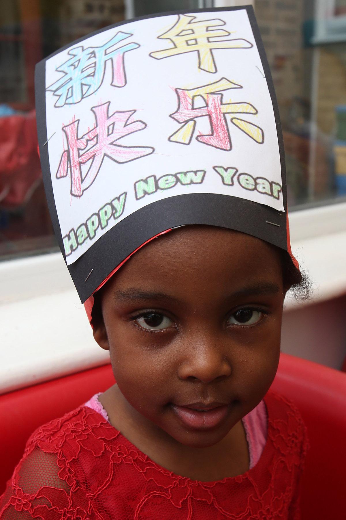 Children and staff at Tiny Tots during their Chinese New Year celebrations. Higham Station Avenue, Chingford. (31/1/2013) EL74876_3