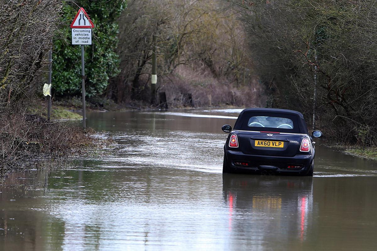 Car in floodwater on Mill Road near Hallsford Bridge, Ongar, Essex. (1/2/2013) EL74961_3