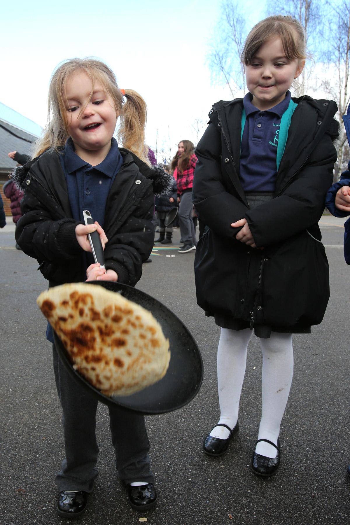 Children at Shelley Primary School flip pancakes, Milton Crescent, Ongar. (4/3/2014) EL75593_3