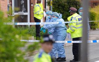 Forensic officers seen at the site of the incident