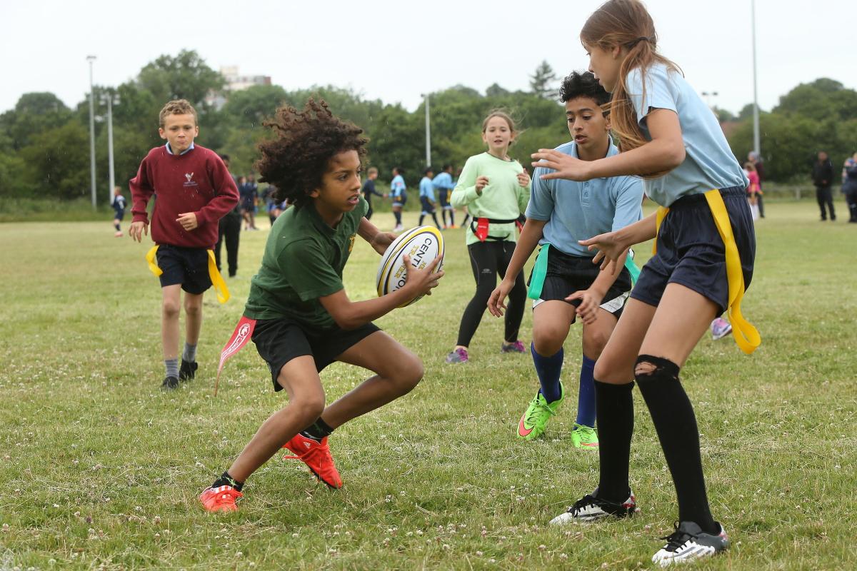 Children from local school's take part in the 6th Christchurch-Eton Manor Tag Rugby Festival. Eton Manor rugby club, Nutter Lane, Wanstead. East London. (22/6/2015) EL84284