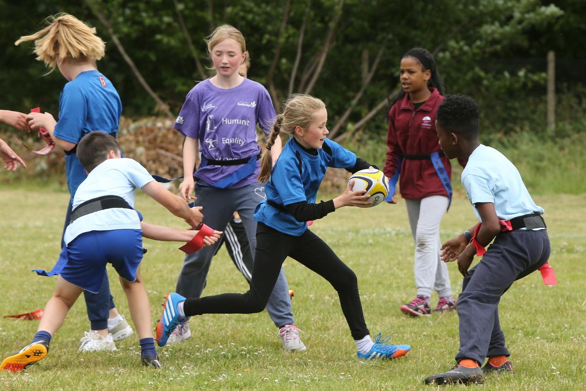 Children from local school's take part in the 6th Christchurch-Eton Manor Tag Rugby Festival. Eton Manor rugby club, Nutter Lane, Wanstead. East London. (22/6/2015) EL84284