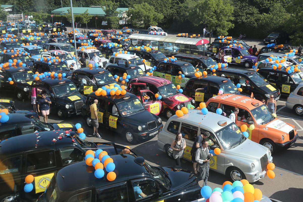 London Taxidrivers' Fund for Underprivileged Children took 300 very deserving children in a convoy of over 100 balloon decorated licensed London black taxis to Southend-on-Sea for a fun filled day. Starting at Sainsbury's in Chingford. East London. (1/7/2
