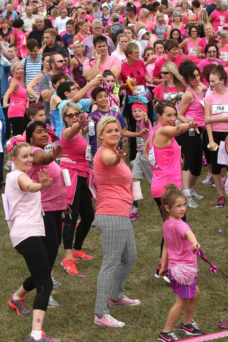 Fundraisers for Cancer Research take part in the Race for Life run at North Weald airfield, Essex. (15/7/2015) EL84614