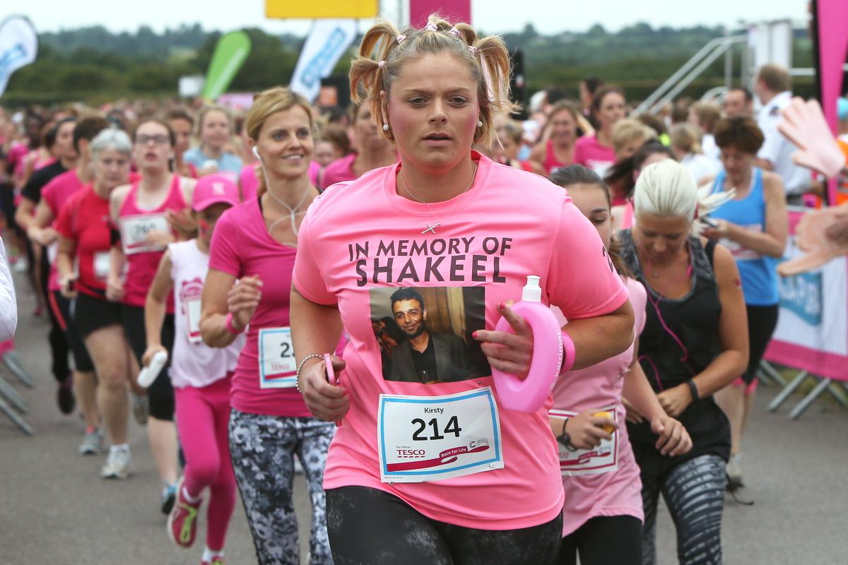 Fundraisers for Cancer Research take part in the Race for Life run at North Weald airfield, Essex. (15/7/2015) EL84614