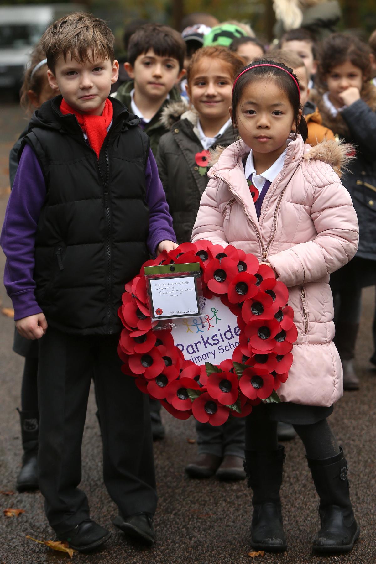 British Legion Remembrance Service at Chingford Mount Cemetery, children from Chingford Foundation, Parkside, Rushcroft and Chace Community from Enfield placed flowers over 200 graves. (6/11/2015) EL86105_6