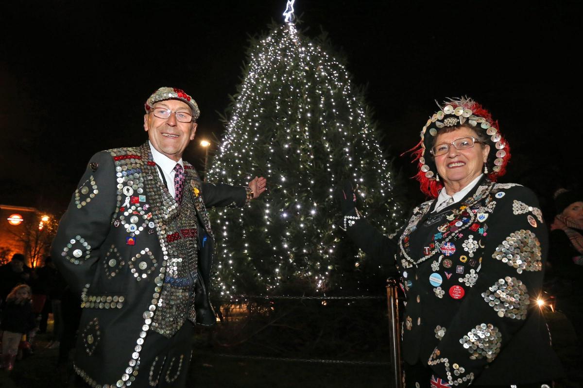 Pearly King Bob Paice (Forest Gate) and Queen Doreen Golding (Old Kent Road and Bow Bells) turn the Wanstead Christmas tree lights on, George Green. Wanstead. (27/11/2015) EL86060_4