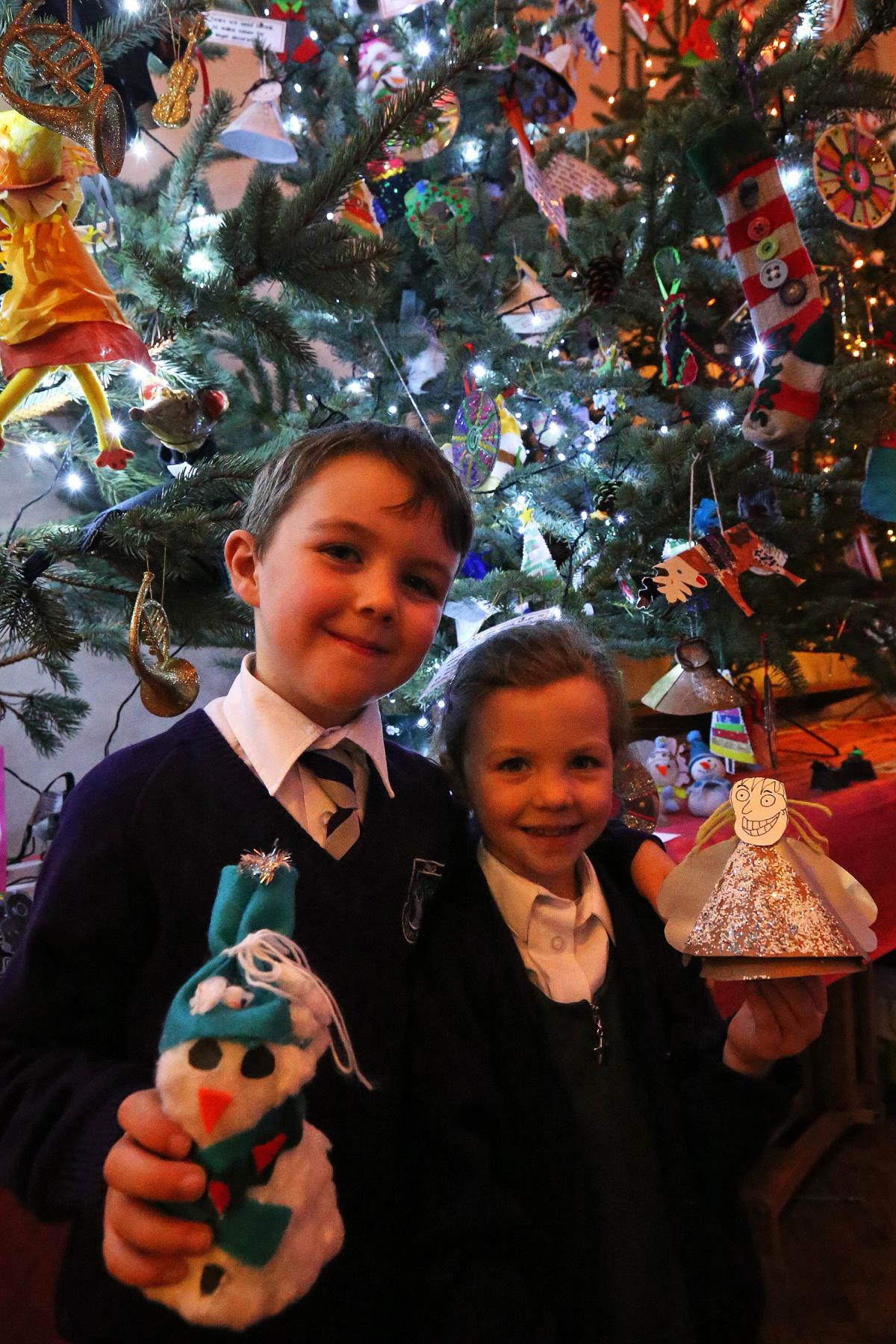 Children from Epping Primary School with decorations for the school tree in the Christmas Tree festival in St. John the Baptist​ church in Epping. Essex. (4/12/2015) EL86063_5