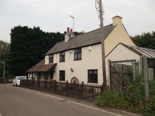 The Plough was a tiny McMullen's house, closed in the late 1970s and converted to a private residence. The brewery built a new Plough public house on the main road, 50 metres away (hidden behind the tree in the above photo).