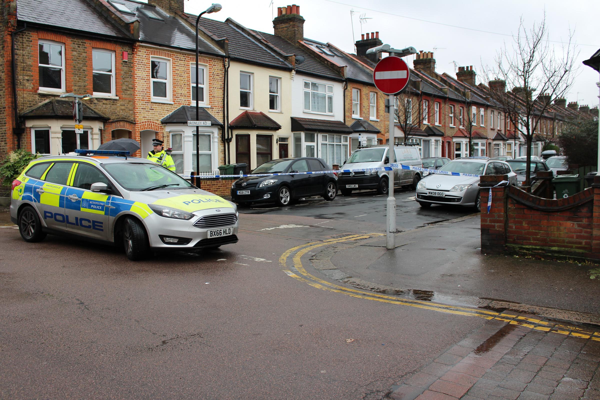 Police officers at the crime scene in Bromley Road the morning after the vicious attack. Photo: Lewis Berrill
