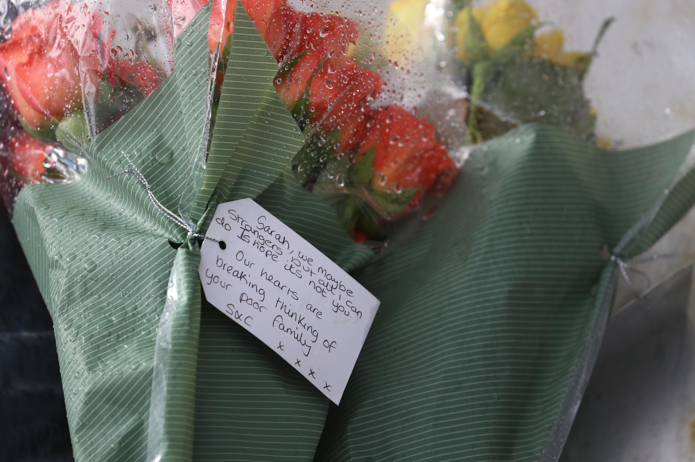 Flowers from members of the public left near Great Chart Golf and Leisure near Ashford in Kent. Photo: PA
