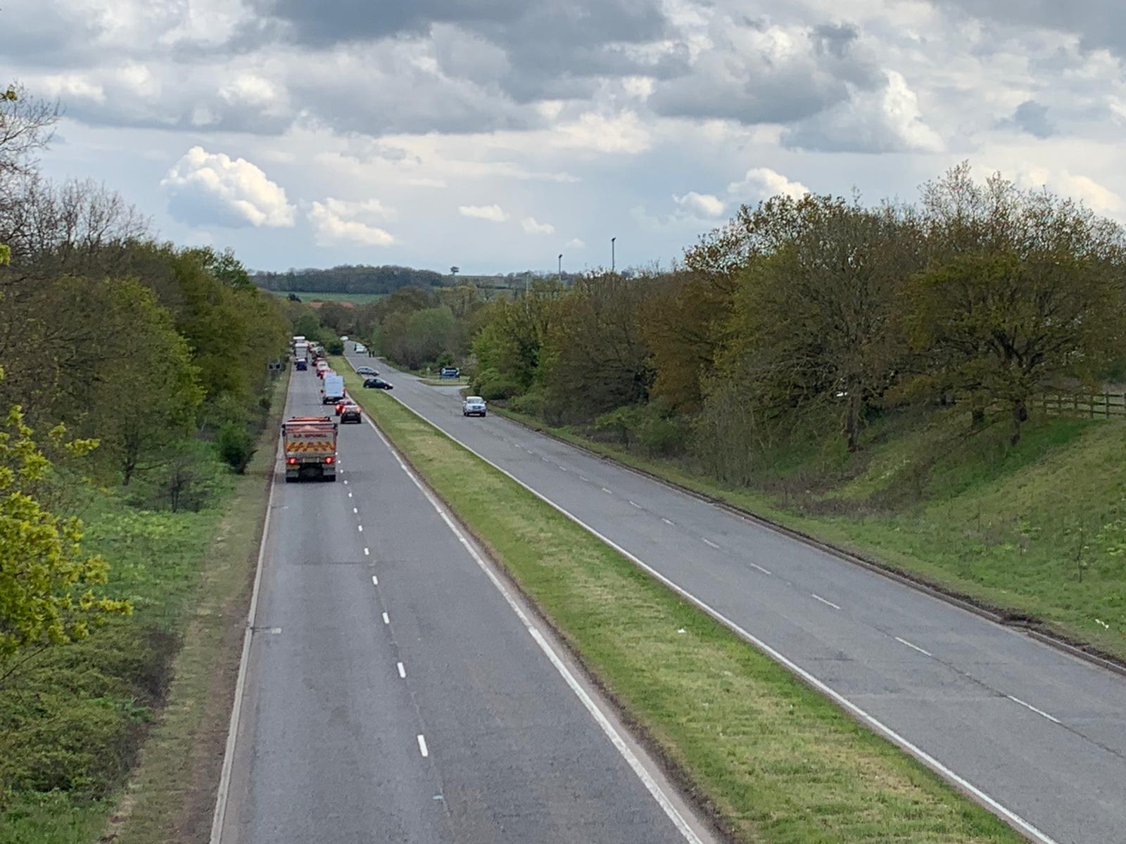 The A1081 dual carriageway. Police officers can be seen in the top right side of the dual carriageway.