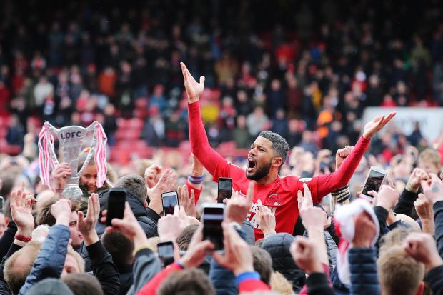 Jobi McAnuff is lifted by Leyton Orient fans Picture: PA