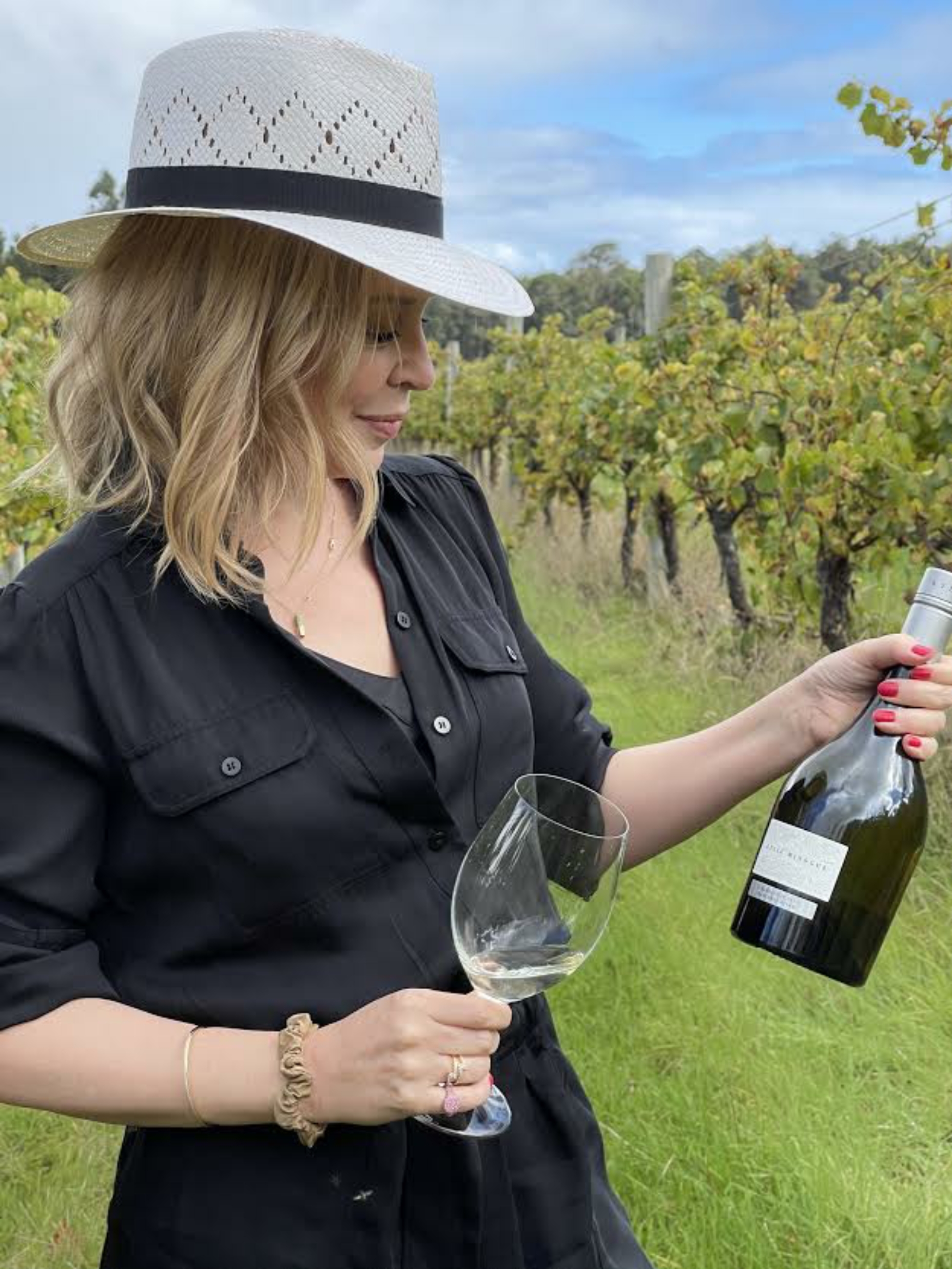 Kylie Minogue with the wine that bears her name