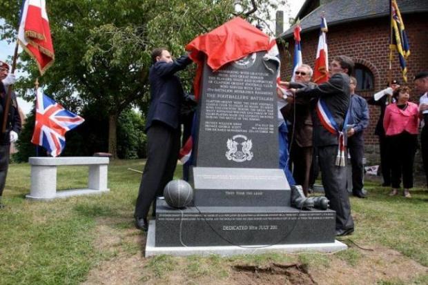 O's Supporters Club chairman David Dodd and former player Peter Kitchen unveil the memorial assisted by the mayor of Flers's first assessor Charles Delette