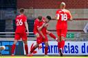 Leyton Orient players celebrate Ruel Sotiriou's (centre) first goal for his side during the pre-season friendly match at The Breyer Group Stadium, London.