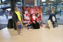 Father Christmas helping a Rotarian with a collection at Tesco