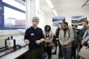 Dr Alex Henshaw, Deputy Head of Queen Mary’s School of Geography, pictured with students working on the Blue Green E17 project