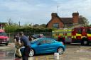 Firefighters at Loughton Fire Station hold a charity car wash