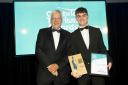 Cumbria Tourism president Jim Walker presents the Unsung Hero Award to Ben McGregor